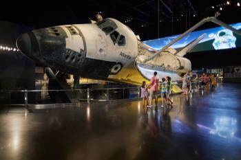 guests viewing the Space Shuttle Atlantis exhibit at Kennedy Space Center